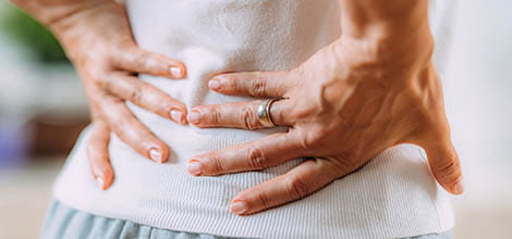 Woman with sciatic nerve pain in her lower back